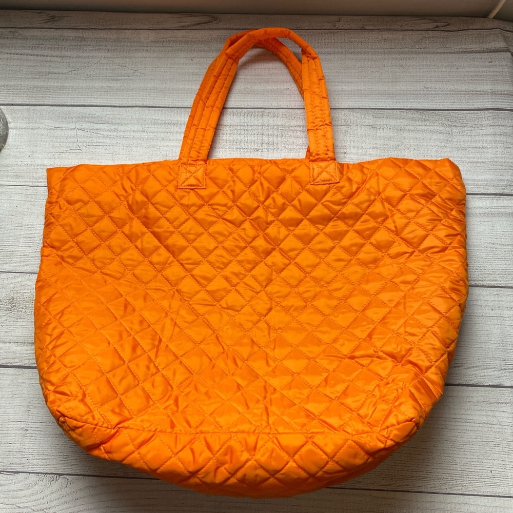 Bright Orange quilted tote bag puffer style paisley lined interior zipper pocket